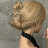 Model wearing the single star Y2K Orbit Hair Claw