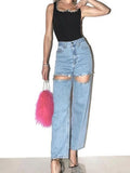 Model wearing the blue Embellished Baddie Cut-Out Jeans