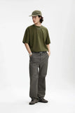 Model wearing the green Essential Everyday T-Shirt