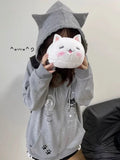 Model wearing the gray Y2K Kitty Paw Print Sweatshirt