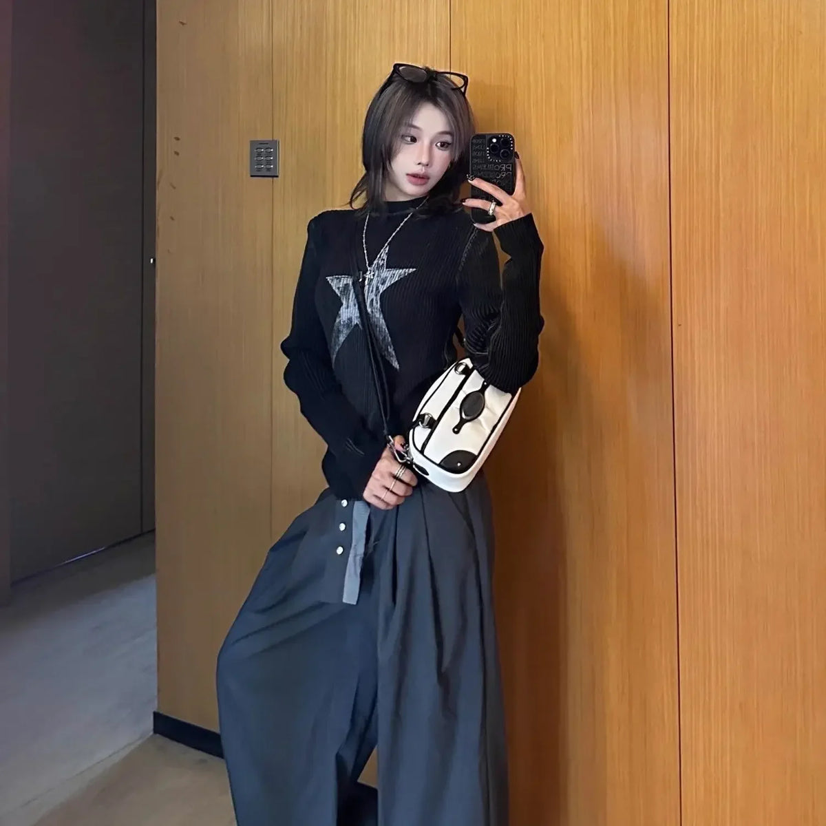 Model wearing the black Y2K Starbrust Sweatshirt 