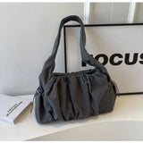 Front view of the gray Wanderlust Sling Bag  