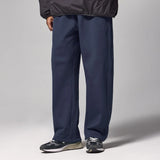Front view of the blue Drawstring Wide-Leg Pants in a gray background