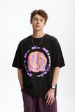 Model wearing the black Serve Up Positivity T-Shirt
