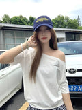 Model wearing the white Relaxed Off-Shoulder T-Shirt 