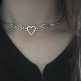 Model wearing the heart wings Starlit Dream Necklace 