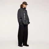 Model wearing the black Relaxed Fit Wide-Leg Cargo Pants