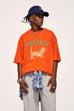 Model wearing the orange ThreadFusion T-Shirt in a gray background