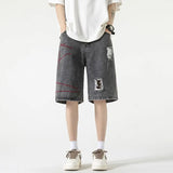 Stylish Spliced Button Zipper Ripped Shorts