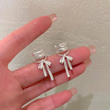 Elegant White Ribbon Clip Earrings