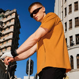 Model wearing the orange Y2K Essential T-Shirt