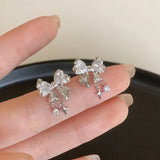 Front view of the white Gleaming Charm Drops Earrings