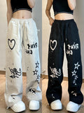 Model wearing the black & white Graffiti-Style Wide-Leg Pants