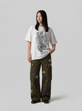 Oversized short-sleeved t-shirt with glitch graphic — model photo