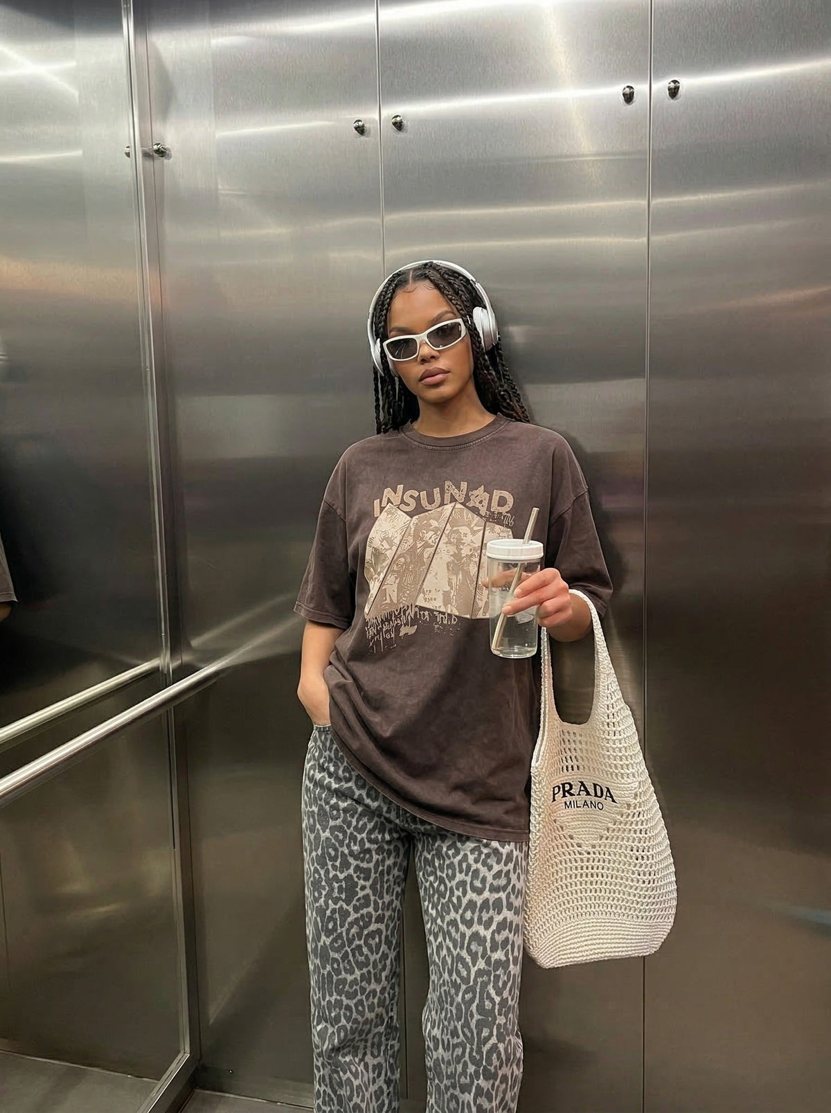 Oversized graphic T-shirt with distressed print — model photo