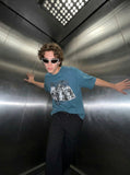Oversized graphic T-shirt with distressed print — model photo
