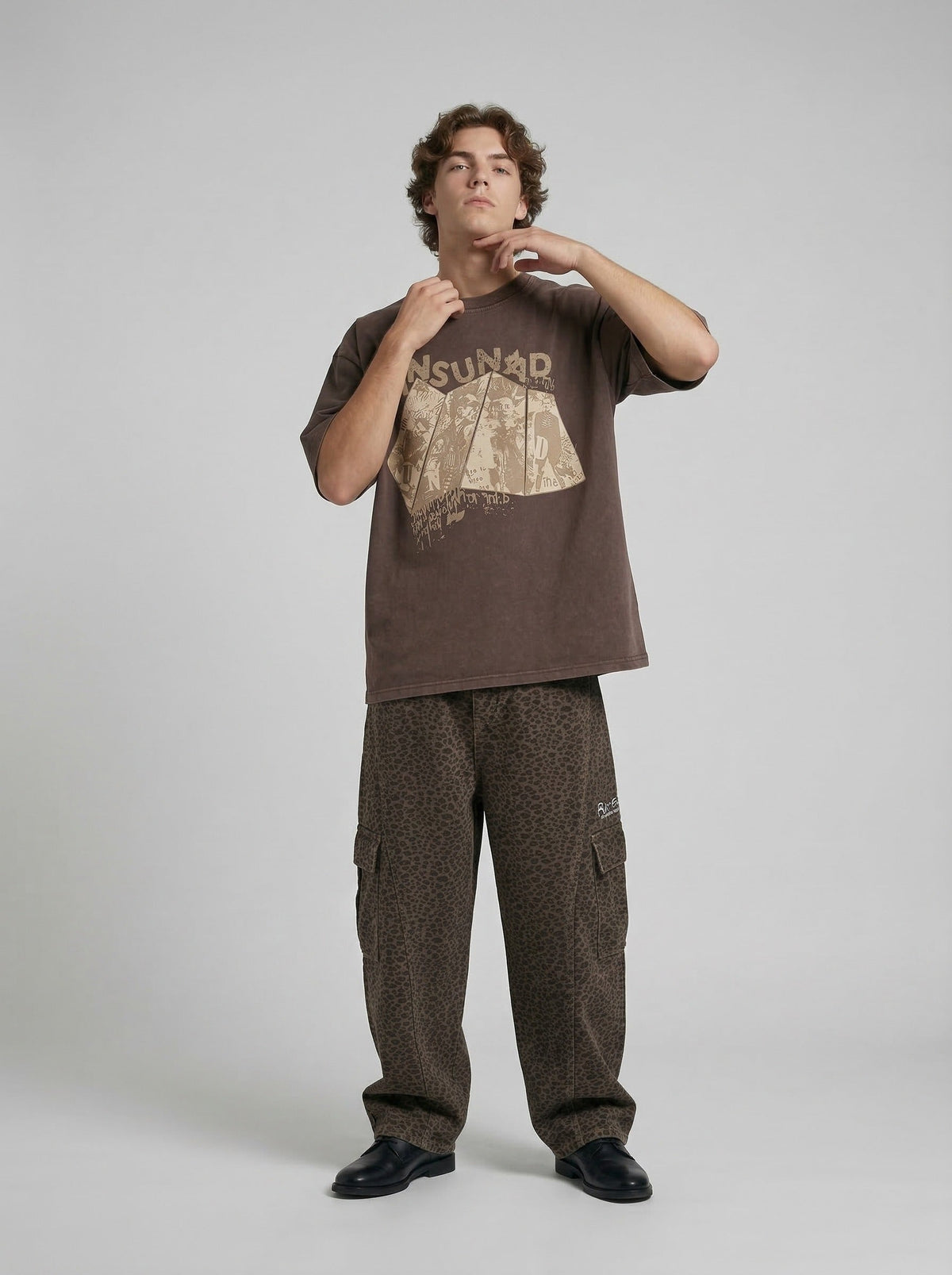 Oversized graphic T-shirt with distressed print — model photo