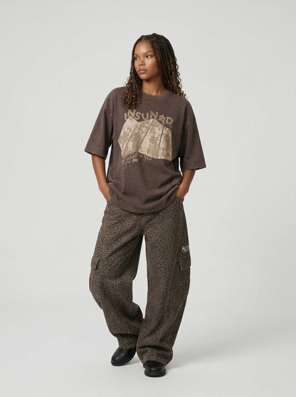 Oversized graphic T-shirt with distressed print — model photo