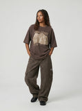 Oversized graphic T-shirt with distressed print — model photo