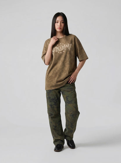 Washed graphic t-shirt with stars and emblem design — model photo