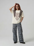 INSUNAD graphic T-shirt with faux-wrap panel — model photo