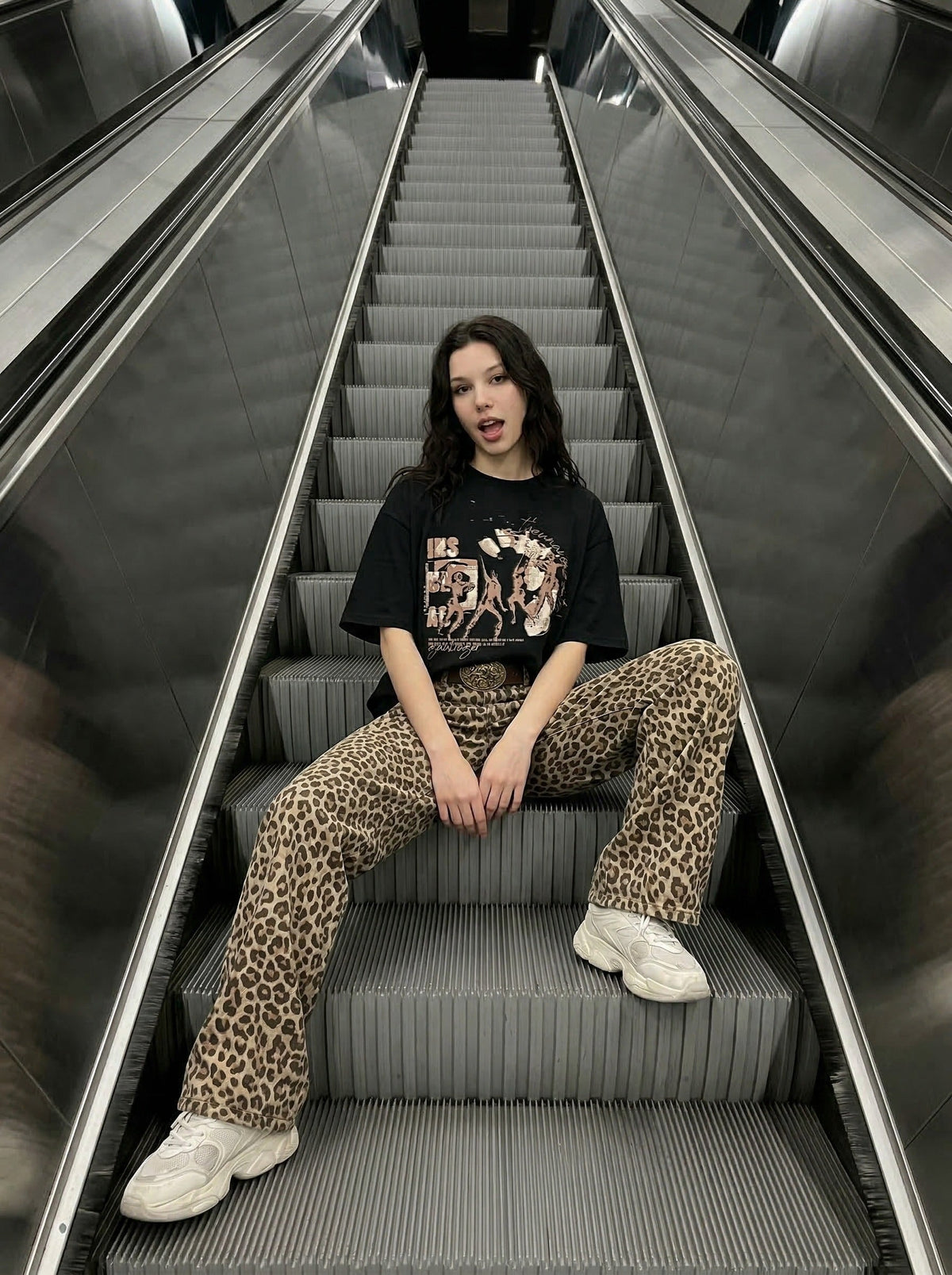 Oversized black and white t-shirt with graphic design — model photo