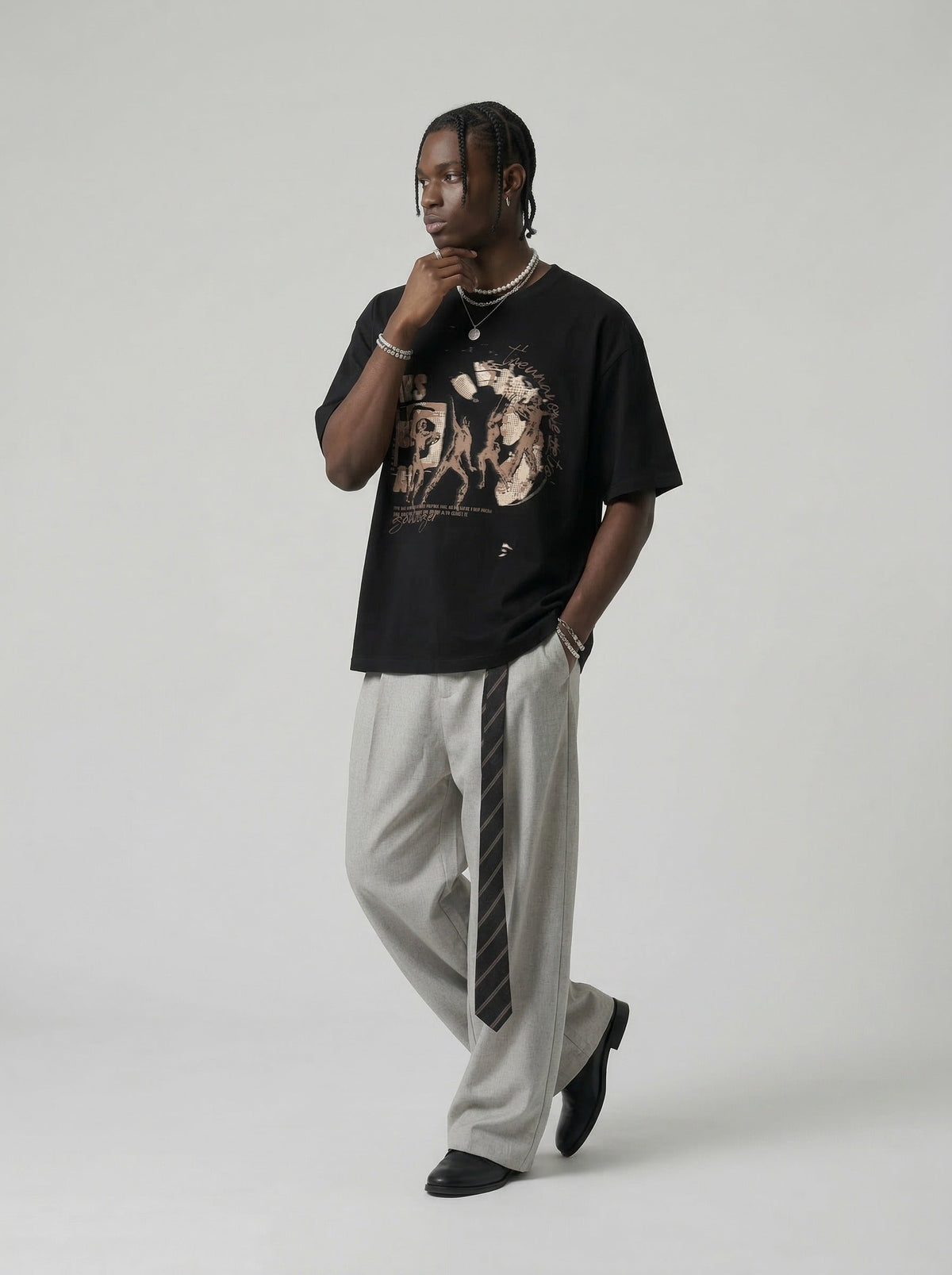 Oversized black and white t-shirt with graphic design — model photo