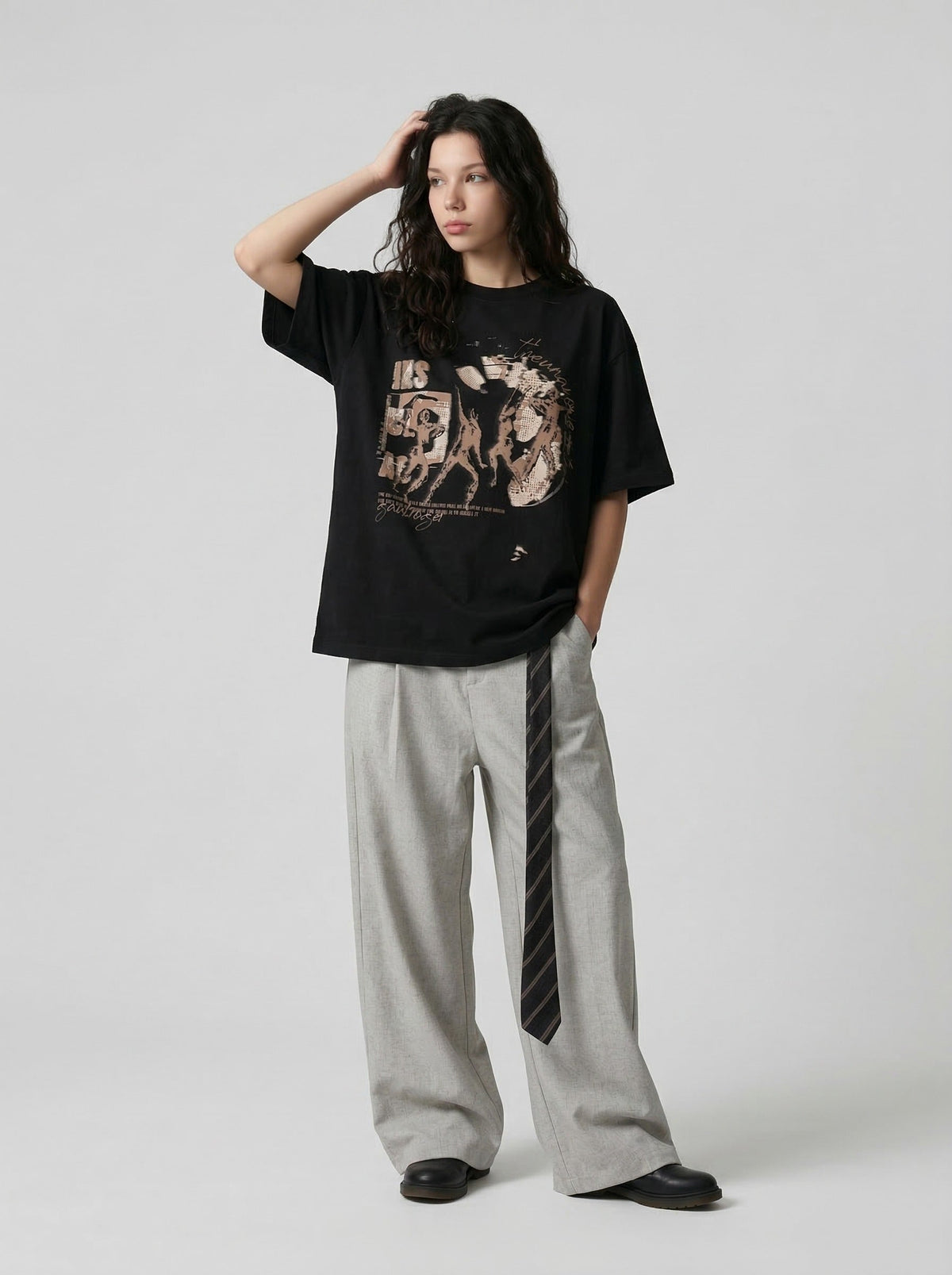 Oversized black and white t-shirt with graphic design — model photo