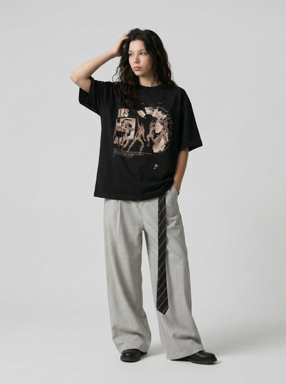 Oversized black and white t-shirt with graphic design — model photo