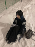 DAXUEN black oversized patchwork knit sweater — model photo