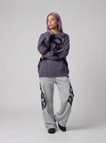 DAXUEN grey oversized distressed skull graphic sweater — model photo