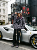 DAXUEN grey oversized distressed skull graphic sweater — model photo
