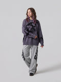 DAXUEN grey oversized distressed skull graphic sweater — model photo