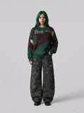 DAXUEN camouflage fuzzy knit sweater — model photo