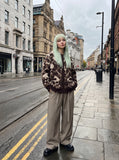 DAXUEN dark brown oversized abstract skull pattern cardigan — model photo