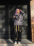 DAXUEN grey oversized distressed skull graphic sweater — model photo