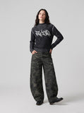 DAXUEN black vertical ribbed abstract graphic mock neck sweater — model photo