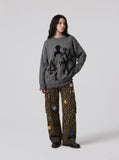 DAXUEN dark grey oversized distressed graphic knit sweater — model photo