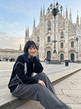 DAXUEN black oversized patchwork knit sweater — model photo