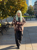 DAXUEN dark brown oversized abstract skull pattern cardigan — model photo