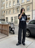 DAXUEN black oversized abstract brushstroke graphic tee — model photo