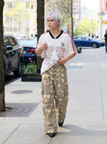 DAXUEN greenish-beige abstract camouflage wide-leg cargo pants — model photo