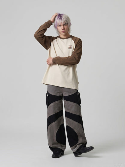 DAXUEN Wide-leg color-block pants with abstract pattern — model photo