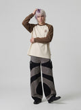 DAXUEN Wide-leg color-block pants with abstract pattern — model photo