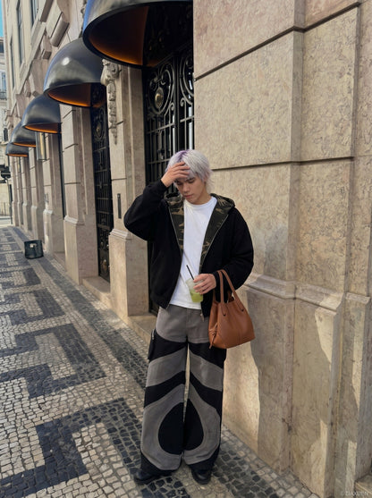 DAXUEN Wide-leg color-block pants with abstract pattern — model photo