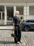 DAXUEN dark charcoal oversized abstract drip print tee — model photo