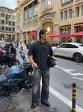 DAXUEN dark charcoal oversized abstract drip print tee — model photo