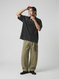 DAXUEN dark charcoal oversized abstract drip print tee — model photo