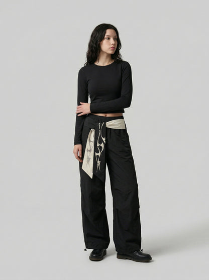 DAXUEN Loose-fitting wide-leg casual pants with abstract graphics — model photo