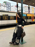 DAXUEN Loose-fitting wide-leg casual pants with abstract graphics — model photo